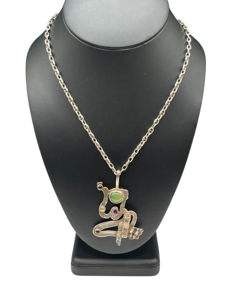 STERLING SILVER MODERNIST ABSTRACT PENDANT FEATURING PRECIOUS STONES AND STERLING NECKLACE: FEATURES A STERLING SILVER MARINER LINK NECKLACE 24" NECKLACE, 2 3/4" PENDANT, 36.91 GRAMS