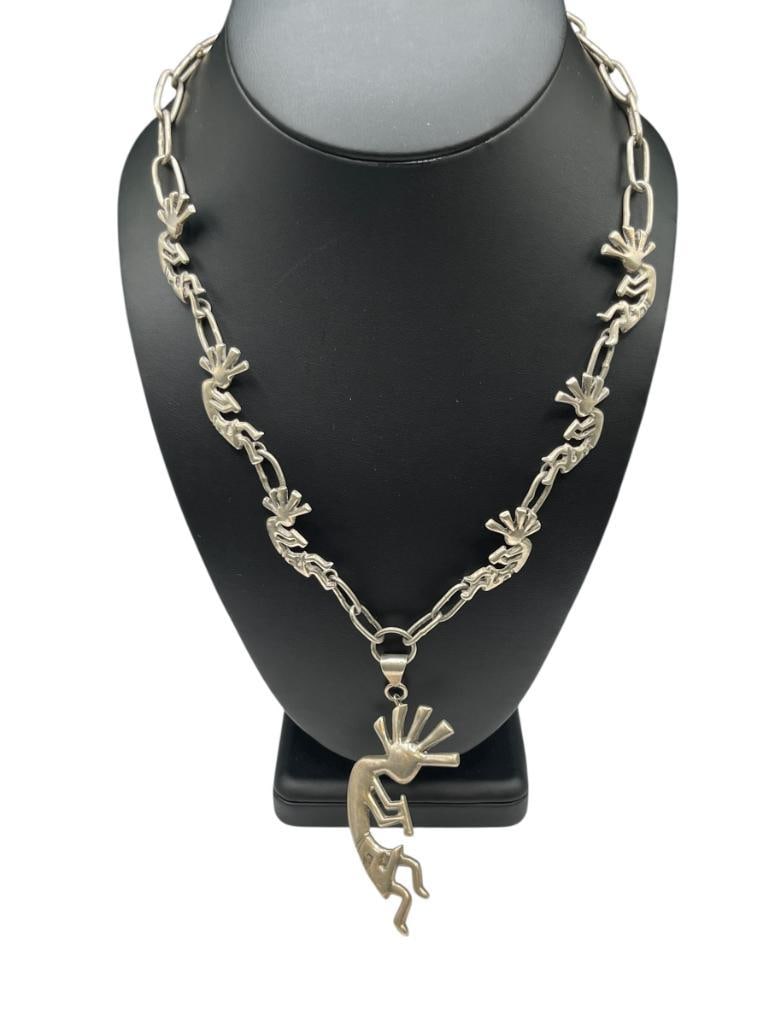 ANTIQUE NAVAJO SIGNED SAND CAST STERLING SILVER KOKOPELLI PENDANT NECKLACE: SIGNED BY ARTIST "KBB" POSSIBLY A BEGAY FAMILY PIECE, NECKALCE FEATURES KOKOPELLI LINKS AS WELL 19" NECKLACE, 3 1/2" PENDANT, 59.73 GRAMS 