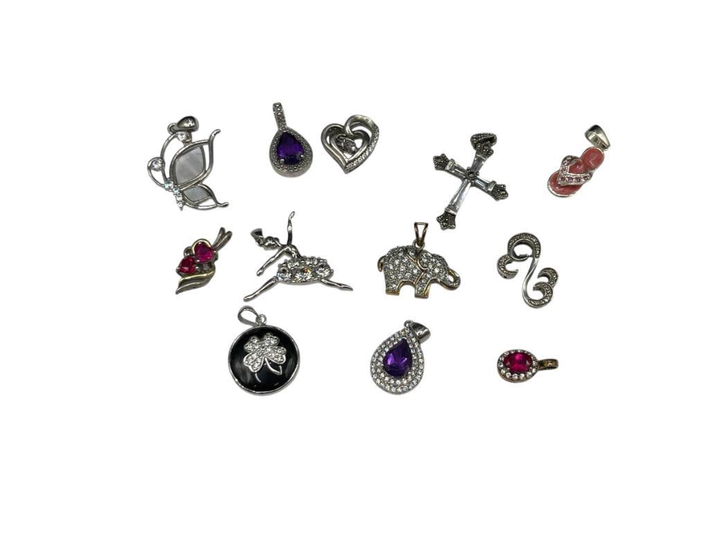 ASSORTED STERLING SILVER PENDANTS FEATURING MARCASITE DESIGNS, FIGURAL STYLES, AND MORE: 29.34 GRAMS 