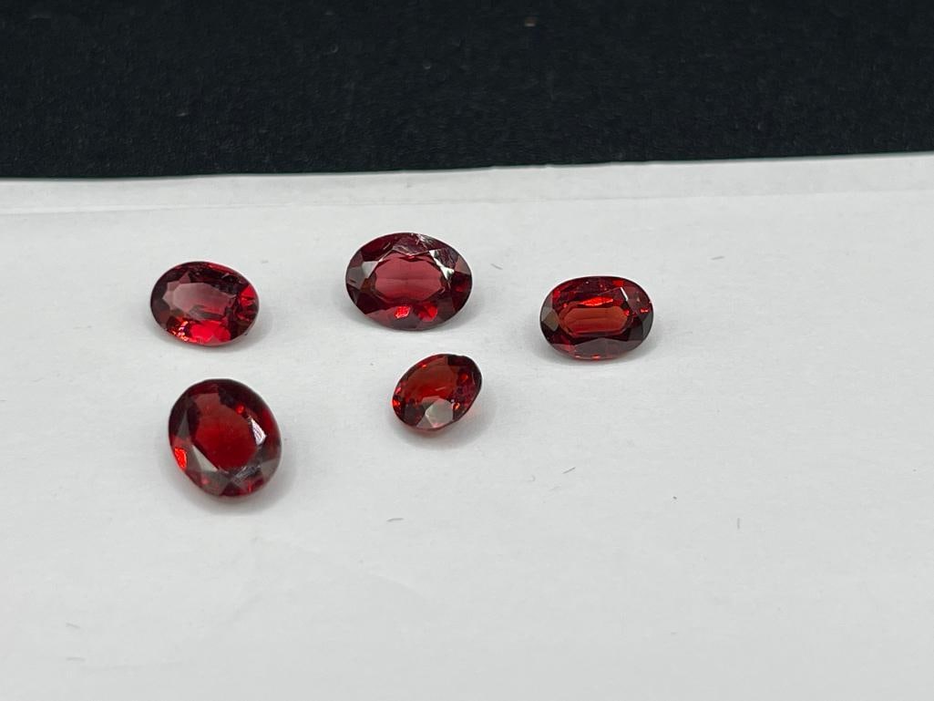 FIVE OVAL CUT GARNETS - 3