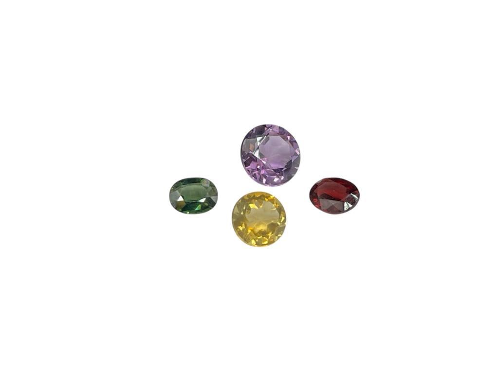 FOUR ROUND AND OVAL CUT GEMSTONES INCLUDING BLUE GREEN SAPPHIRE, CITRINE, AMETHYST, AND GARNET (1 of 4)