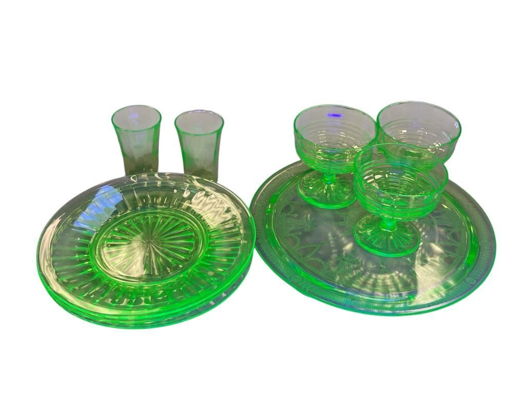DEPRESSION ERA URANIUM GLASS BY ANCHOR HOCKING BRIGHT GLOW UNDER BLACKLIGHT: PILLAR OPTIC PLATES, BOCK OPTIC SHERBET GLASSES, AND BALLERINA CAKE PLATE BY ANCHOR HOCKING PLUS TWO ETCHED GLASSES, ONE PLATE HAS SMALL CHIP ON THE RIM, ALL PIECES GLOW UNDER BLACK LIGHT 8 1/4" PLATE