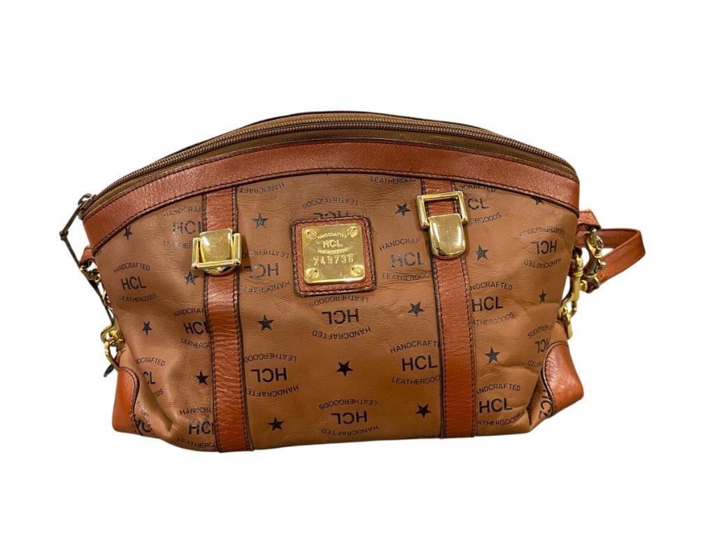 VINTAGE HCL HAND CRAFTED LEATHER GOODS BROWN LEATHER SATCHEL SERIAL 249736: LOGO MONOGRAM WITH GOLD TONE HARDWARE, LIGHT SIGNS OF WEAR ON THE BOTTOM, BELIEVED TO BE AUTHENTIC 12" X 7" X 6"