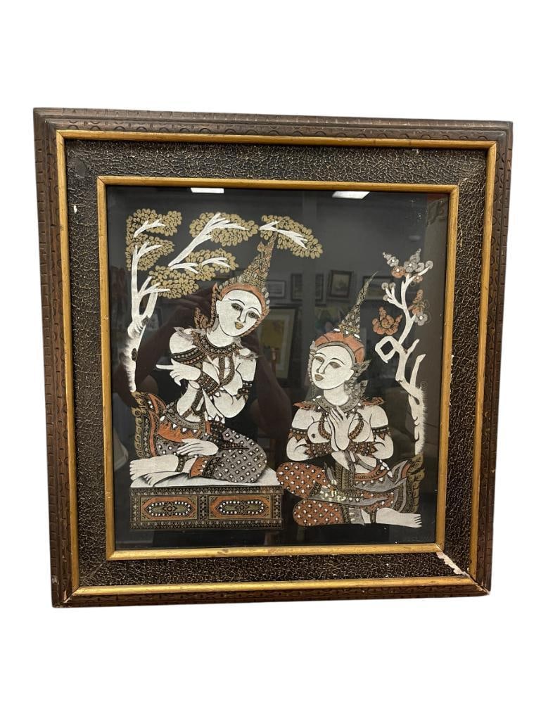 VINTAGE THAI SILK PAINTING OF TWO SEATED FEMALE FIGURES: SILVER, COPPER, GOLD COLORS,ART DEPICTS TWO SEATED WOMEN NEAR TREES, FRAMED 24" X 25" FRAME 