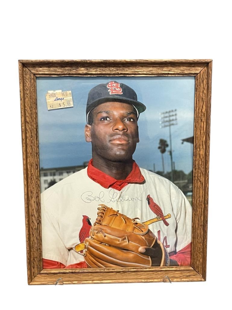 BOB GIBSON AUTOGRPAHED COLOR PHOTOGRAPH FORMER AMERICAN BASEBALL PITCHER: GIBSON (1935-2020) PLAYED HIS ENTIRE CAREER AS A CARDINAL FROM 1959-1975, SIGNED NEAR BOTTOM CENTER, FRAMED,COLLECTION FROM A LOCAL RENO, NV DOCTOR AT RENOWN WHO RAN BIG LEAGUE SPRORTS MEDICINE