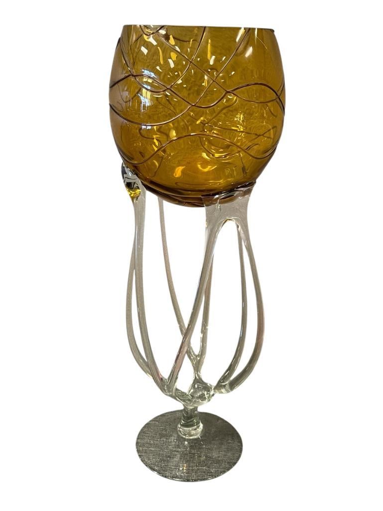 1980'S JELLY FISH AMBER AND CLEAR ART GLASS FOOTED BOWL POSIBLY JOSEFINA GLASS WORKS IN POLAND: AMBER BOWL WITH SWIRL DESIGN AND CLEAR GLASS PEDESTAL AND ROUND BASE, NO CHIPS OR CRACKS 19" H 