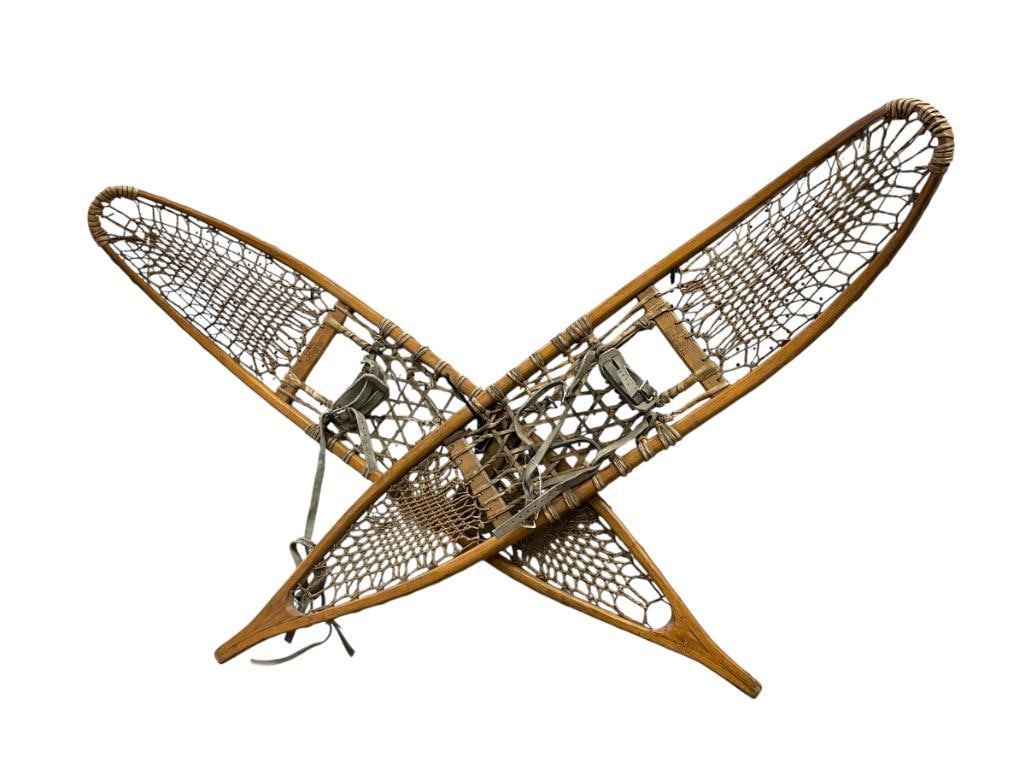 PAIR OF VINTAGE U.S. MILITARY C.A. LUND CO. 1952 SNOWSHOES MADE IN ST. PAUL, MINNESOTA: FEATURING MILITARY U.S. MARK, MAKER'S MARK, AND NUMBERED "1952" AS WELL AS "6652" BY MILITARY, WOODEN FRAME WITH ORIGINAL HIDE WEBBING, GOOD CONDITION FOR AGE 53" 