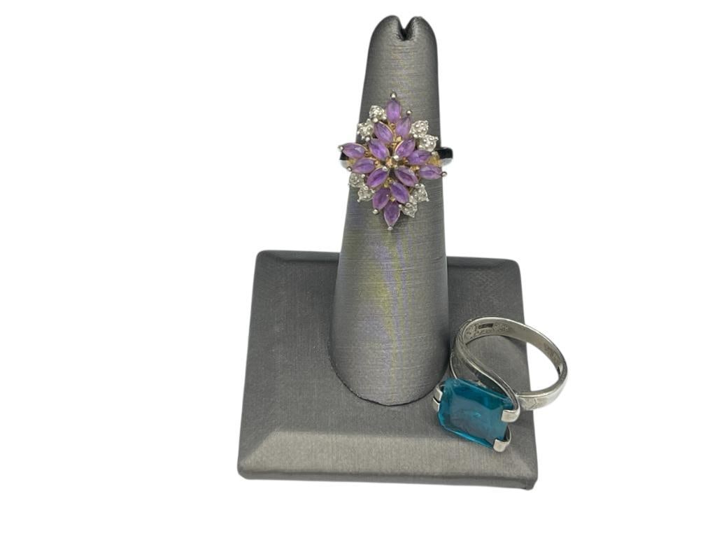 TWO STERLING SILVER FASHION RINGS FEATURING ONE WITH MARQUISE CUT AMETHYSTS: OTHER FEATURES SIMULATED BLUE STONE SIZES 5 1/2 AND 7 1/2, 10.41 GRAMS 