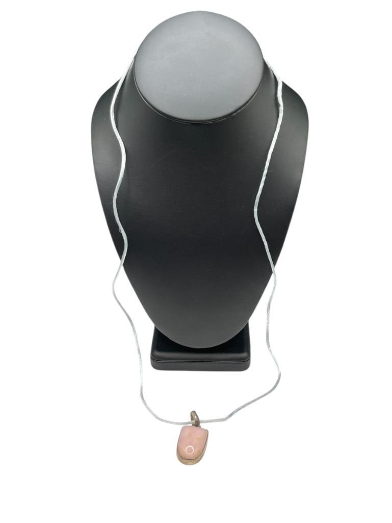 STERLING SILVER POLISHED PINK STONE PENDANT NECKLACE: ON NYLON CORD NECKLACE 1 1/2" PENDANT WITH BAIL, 31" NECKLACE STRAND, 10.8 GRAMS PENDANT 