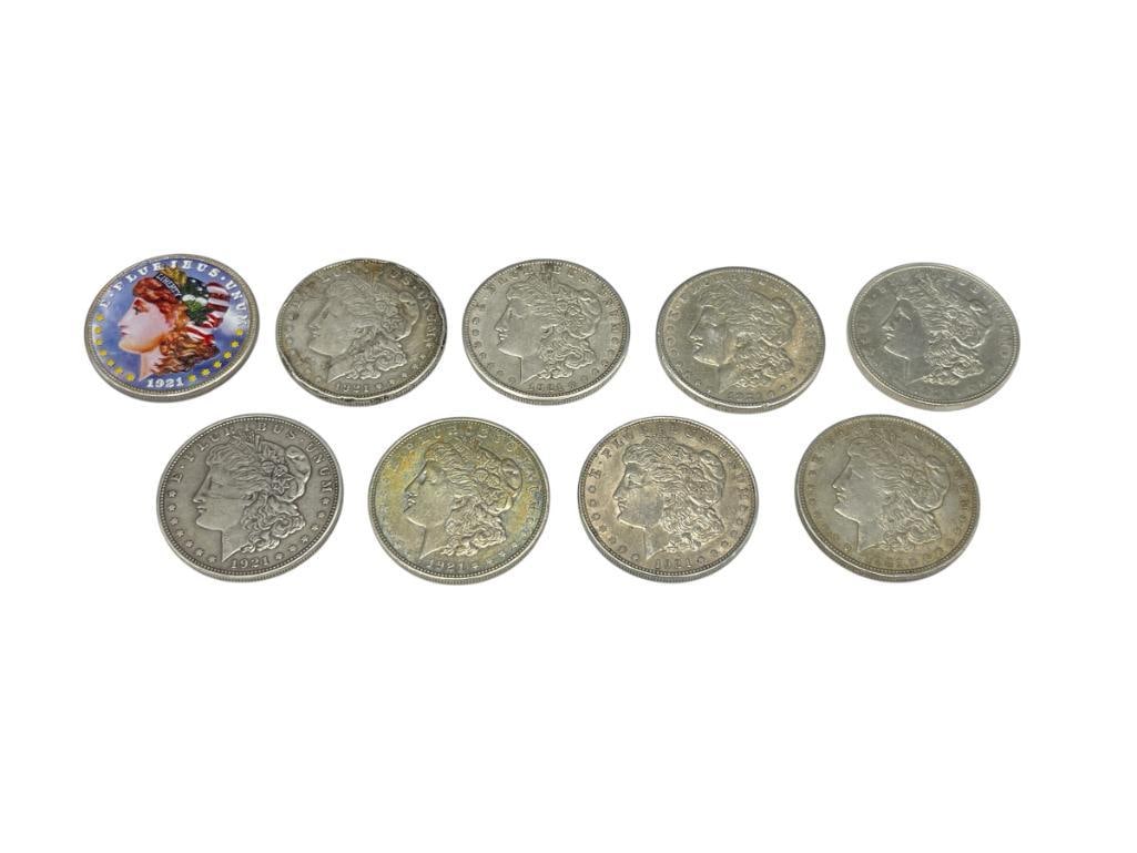 NINE U.S. MORGAN SILVER DOLLARS FROM 1921 FEATURING VARIOUS MINT MARKS: INCLUDES ONE COLORIZED, 90% SILVER 