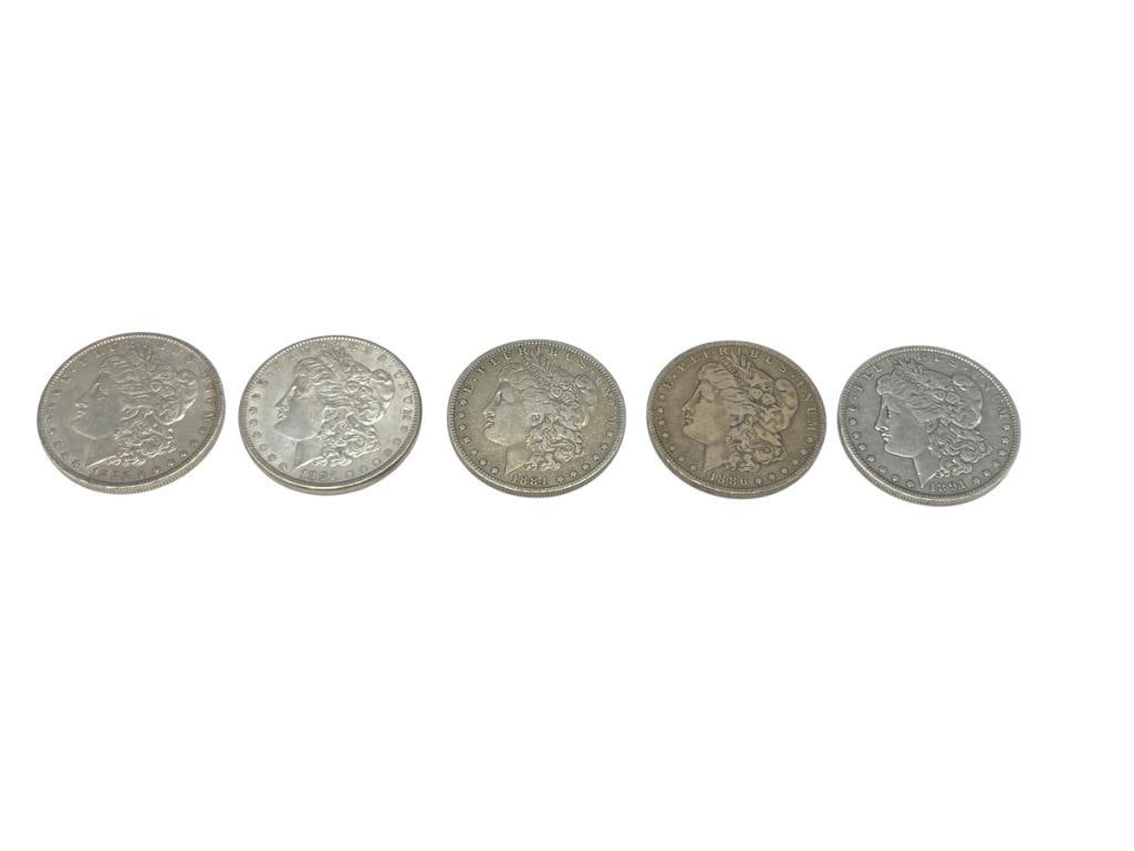 FIVE U.S. MORGAN SILVER DOLLARS FEATURING VARIOUS DATES AND MINT MARKS: 90% SILVER 