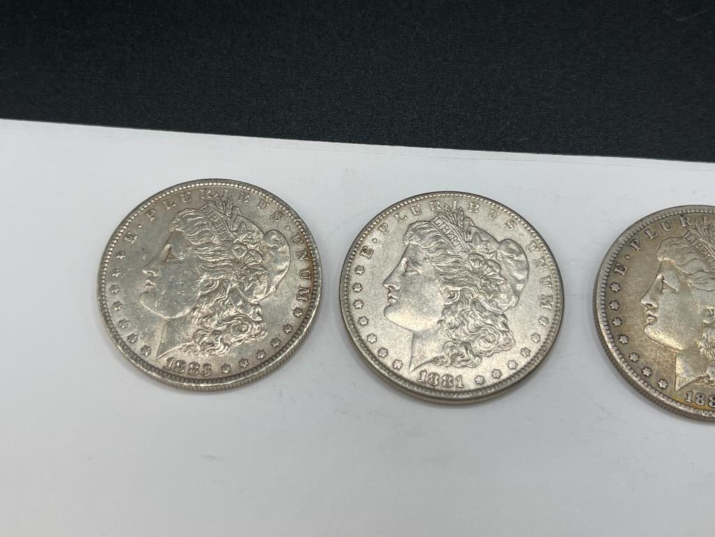 FIVE U.S. MORGAN SILVER DOLLARS FEATURING VARIOUS DATES AND MINT MARKS - 2