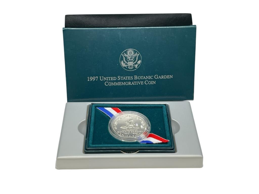 1997 U.S. MINT BOTANIC GARDENS COMMEMORATIVE 90% SILVER DOLLAR: INCLUDES ORIGINAL CASE, BOX, AND CERTIFICATE OF AUTHENTICITY 26.73 GRAMS 