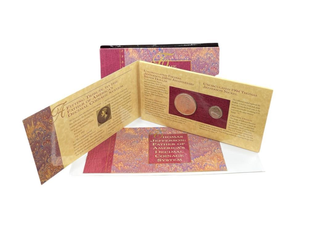 THE THOMAS JEFFERSON COINAGE AND CURRENCY SET FEATURING A 90% SILVER DOLLAR: ALSO INCLUDES JEFEFRSON NICKEL AND $2 CURRENCY NOTE, INCLUDES BOOKLET DISPLAY CASE 26.73 GRAM SILVER DOLLAR 