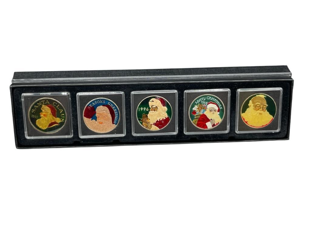 FIVE ENAMELED CHRISTMAS HOLIDAY THEMED .999 FINE SILVER ROUNDS FEATURING SANTA CLAUS: DATES FROM 1990'S, IN CASE 1 TROY OUNCE EACH 