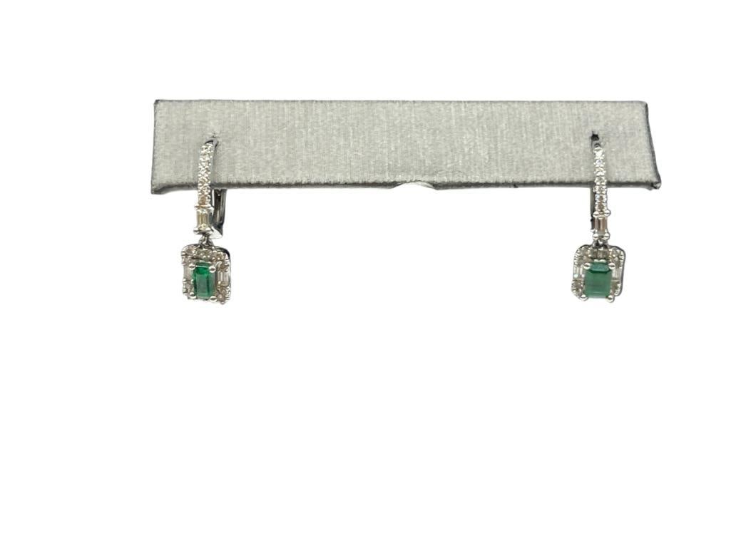 14K WHITE GOLD EMERALD CUT SIMULATED EMERALDS AND DIAMOND DANGLE EARRINGS: FEATURING LEVER BACKS AND VARIOUS CUT DIAMONDS 7/8", 5MM X 3MM SIMULATED EMERALDS, .25CTTW DIAMONDS, 2.64 GRAMS 