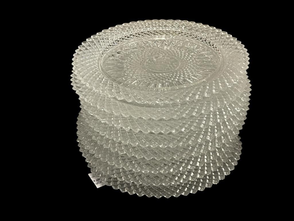 AVON BY FOSTORIA CUT GLASS LUNCHEON PLATES WITH VARIOUS CENTER DESIGNS CIRCA 1970'S: SET OF EIGHT, FEW HAVE ONE PLATE HAS "TINY" CHIPS ON THE EDGE 8" ROUND