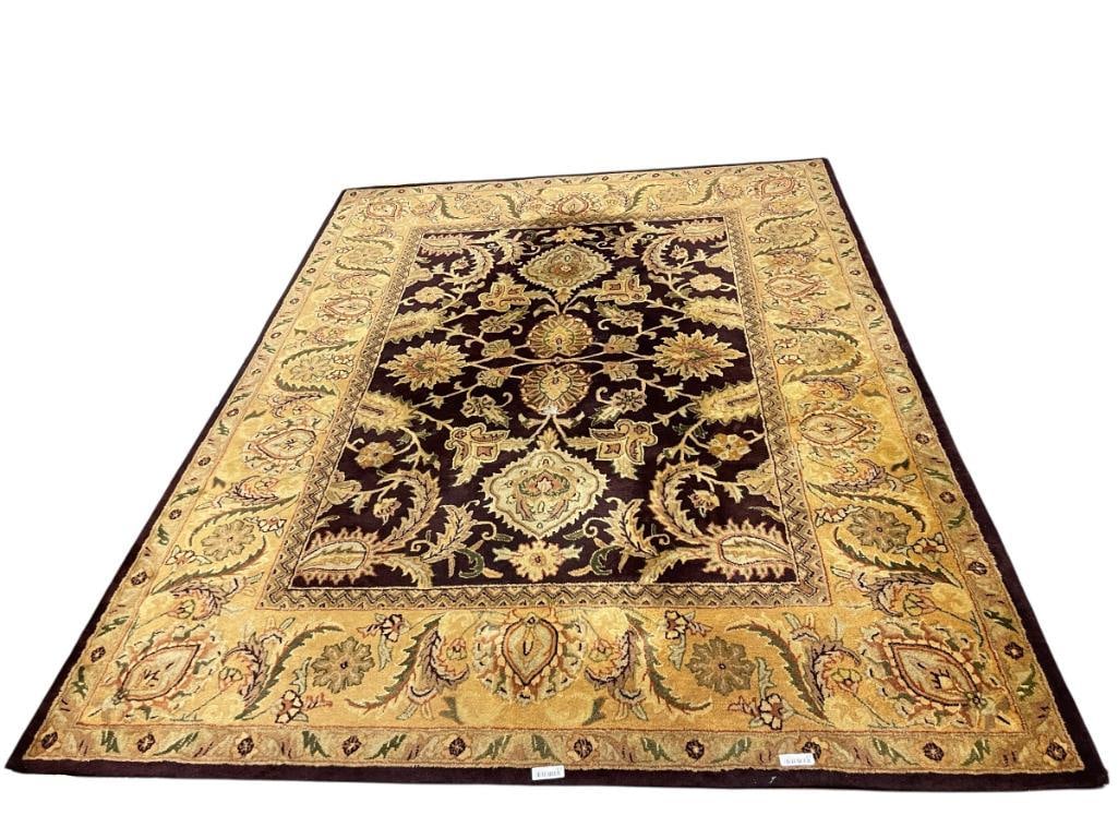 SAFAVIEH HAND TUFTED EGG PLANT AND GOLD WOOL PILE AREA RUG MADE IN INDIA: HAND TUFTED AREA RUG, OVERALL IN GOOD CONDITION, BUT CENTER SHOWS WEAR SPOT, ORIGINAL PRICE OF $840 STATED BY THE ESTATE 80" X 114" 