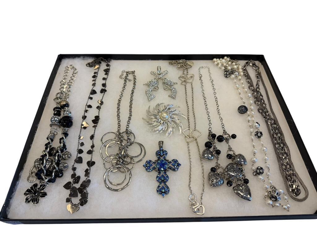 ASSORTED ART DECO STYLE COSTUME JEWELRY STATEMENT NECKLACES AND PENDANTS FEATURING RHINESTONES: ALSO INCLUDES FIGURAL CROSS DESIGNS, FIGURAL HEARTS, AND CHAIN LINK NECKLACE, SARA COVENTRY SIGNED SUN WITH FAUX PEARL BROOCH, HARAJUKU LOVERS, AND MORE 
