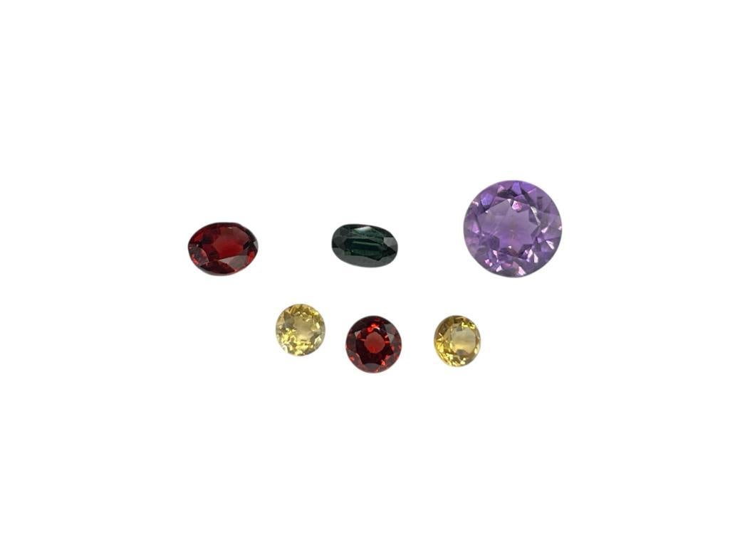 8.15CTTW OF LOOSE GEMSTONES INCLUDING BLUE GREEN SAPPHIRES, AMETHYST, CITRINE, AND GARNET: VARIOUS CUTS AND SIZES 8.15CTTW 