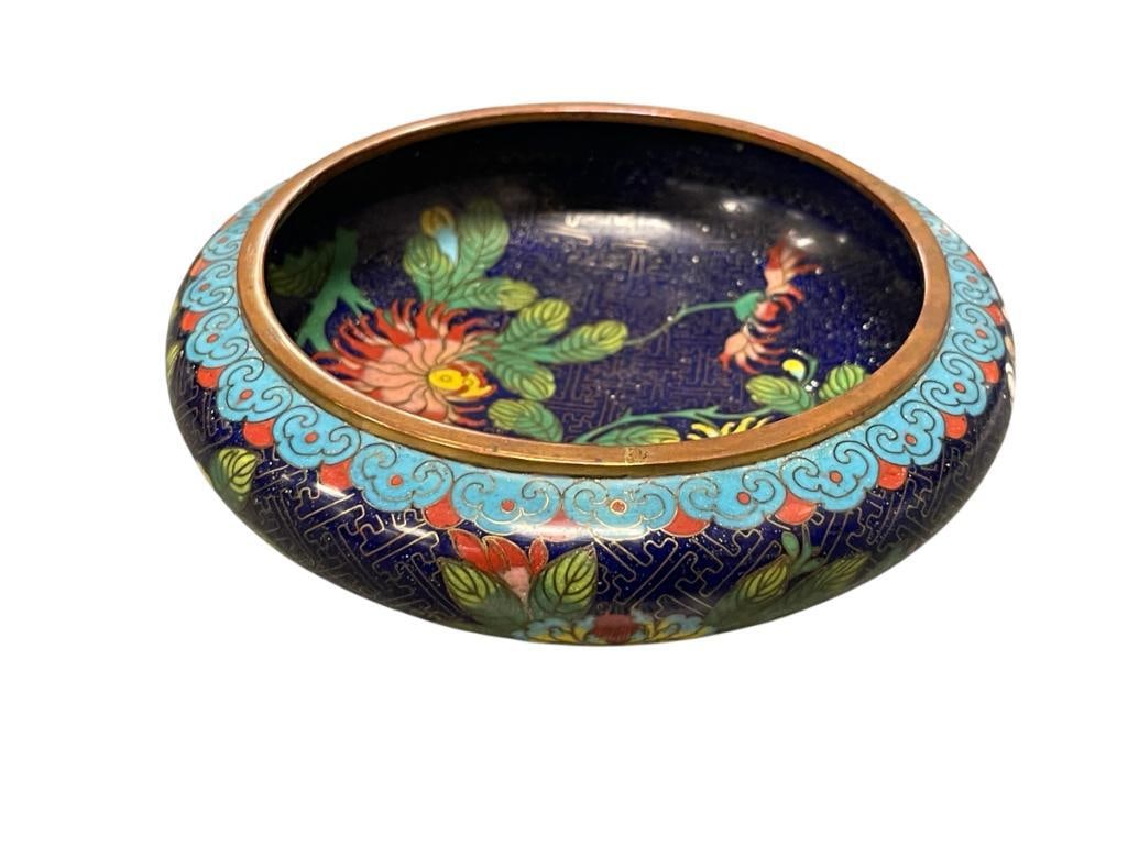 20TH CENTURY CHINESE CLOISONNE ENAMEL ON BRASS BRUSH BOWL INTRICATE WIRE-WORK WITH FLORAL DESIGN: COLORFUL CHRYSANTHEMUMS FLORAL DESIGN BOWL WITH DARK BLUE BACKGROUND, LOTUS AND CHERRY BLOSSOM DECORATED EXTERIOR, LIGHT BLUE ENAMELED BOTTOM, NO DAMAGE OR DENTS AROUND THE BOTTOM 5 1/2" ROUND, 1