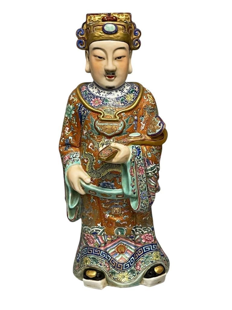 LATE QING DYNASTY CHINESE PORCELAIN TAOIST IMMORTAL / EMPEROR FIGURE ORNATE FAMILLE ROSE STYLE: ORNATE MULTICOLORED PORCELAIN TAOIST FIGURE HOLDING RUYI SCEPTER, HAND GILT DECORATED WITH FLORAL AND DRAGON MOTIF, MARKED ON THE BOTTOM WITH FOUR CHARACTERS, NO DAMAGE 15" H 