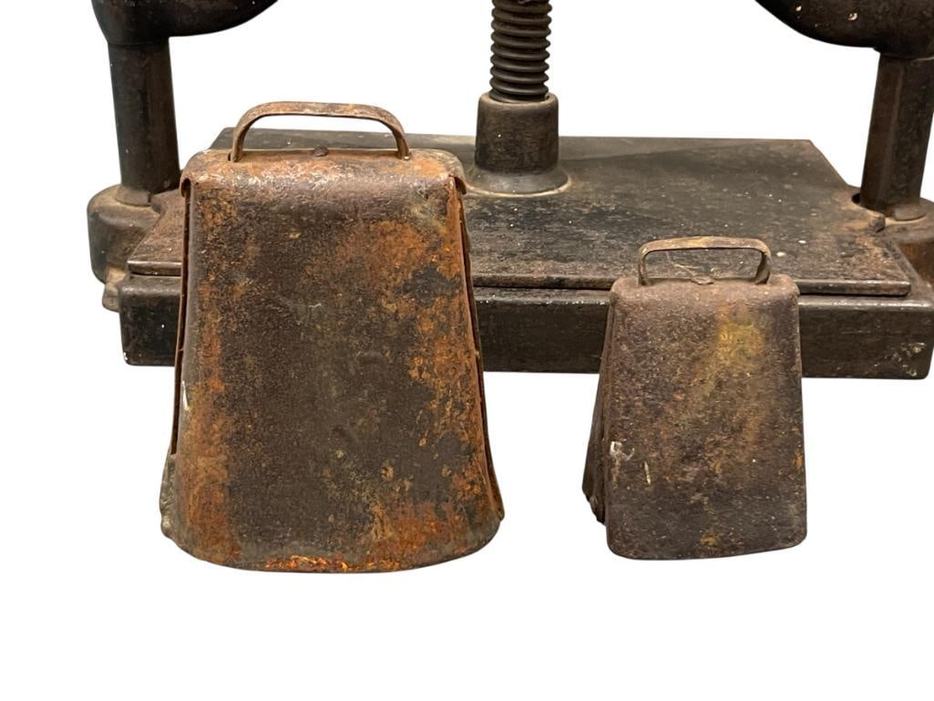 TWO ANTIQUE IRON CATTLE / COW / LIVESTOCK BELLS WITH CLAPPERS HAND FORGED FROM IRON SHEETS: EACH WITH LOOP HANDLE TO ATTACH TO A COLLAR, USED TO LOCATE LIVESTOCK 4 1/2" AND 6 1/2" H 