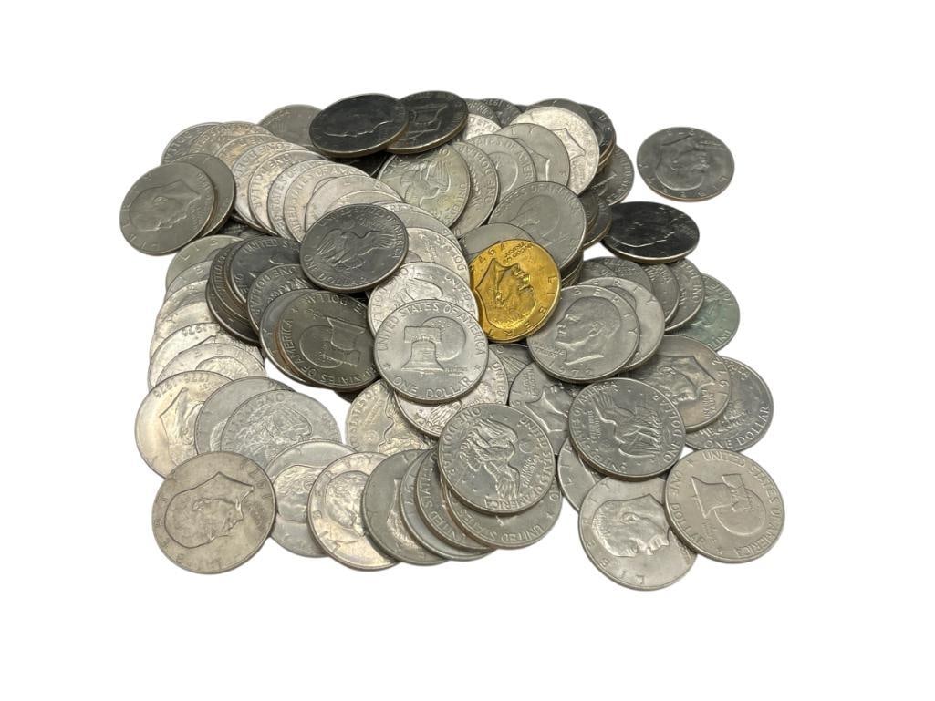 100 U.S. EISENHOWER DOLLARS DATING BACK TO THE 1970'S: ONE HAS BEEN GOLD TONE PLATED, VARIOUS DATES AND MINT MARKS 