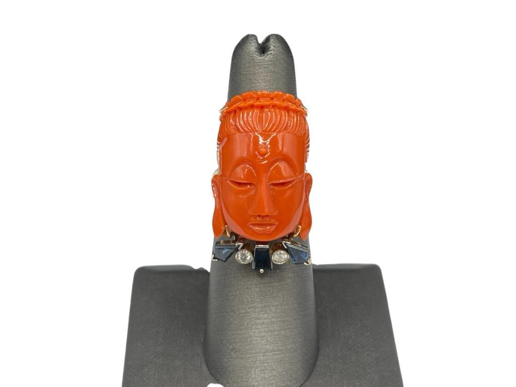 VINTAGE 14K YELLOW GOLD CARVED CORAL, BLUE SAPPHIRE, AND DIAMOND RING MADE BY KING JEWELRY AND WA...: MADE BY HONG KONG CHINESE JEWELRY DESIGNERS, MARKED ON ORIGINAL BOX, FEATURING CARVED CORAL DEPICTING A CHINESE WOMAN'S FACE ACCENTED BY THREE BLUE SAPPHIRES AND TWO ROUND BRILLIANT CUT DIAMONDS