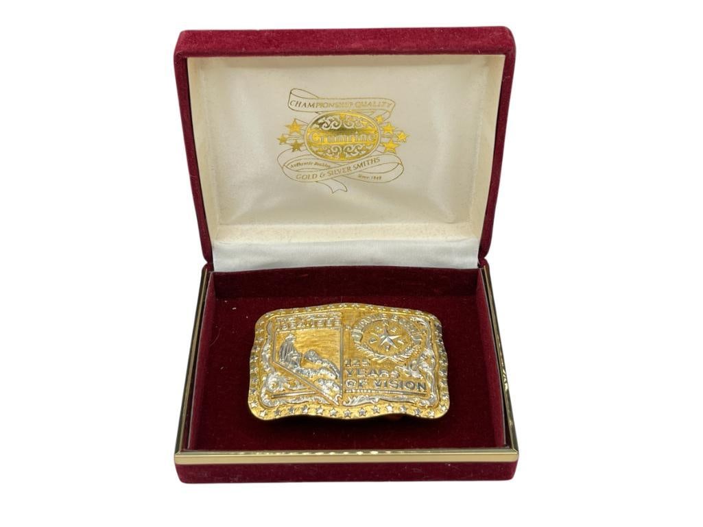 CRUMRINE LIMITED EDITION NEVADA QUASQUICENTENNIAL 125 YEARS 22K GOLD PLATED STERLING BELT BUCKLE: FEATURING EXCEPTIONAL DETAIL OF NEVADA STATEHOOD, "BATTLE BORN,", MARKED ON BACK BY CRUMRIME, MADE OF STERLING SILVER, INSCRIBED "#86 THANK YOU RON, UNWAVERING FRIENDSHIP LEE 11-22-2008," IN ORIGINAL
