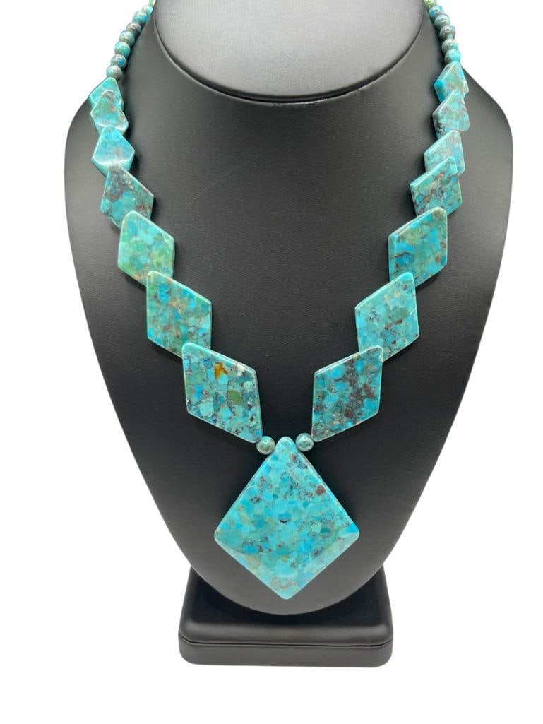 VINTAGE COMPOSITE TURQUOISE GRADUATED BEAD NECKLACE WITH STERLING SILVER CLASP: UNIQUE DESIGN OF DIAMOND SHAPED COMPOSITE TURQUOISE BEADS 18" WITH 2 1/4" DROP PENDANT 