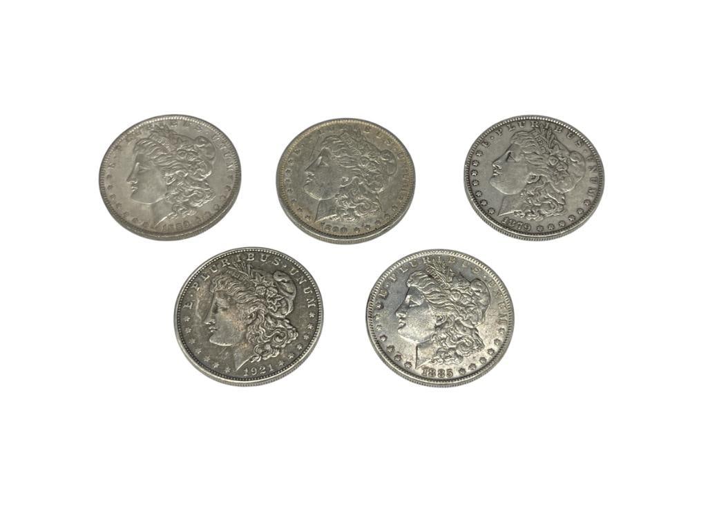 FIVE U.S. MORGAN SILVER DOLLARS FEATURING VARIOUS DATES AND MINT MARKS