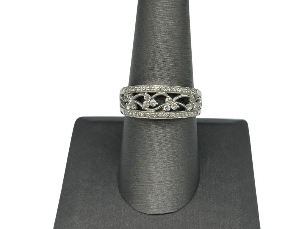 14K WHITE GOLD DIAMOND FILIGREE RING FEATURING FLORAL DESIGN: ACCENTED BY 48 ROUND BRILLIANT CUT DIAMONDS SIZE 8 1/2, 4.28 GRAMS, 5/16" FRONT, 12 2MM DIAMONDS, 36 1MM DIAMONDS 