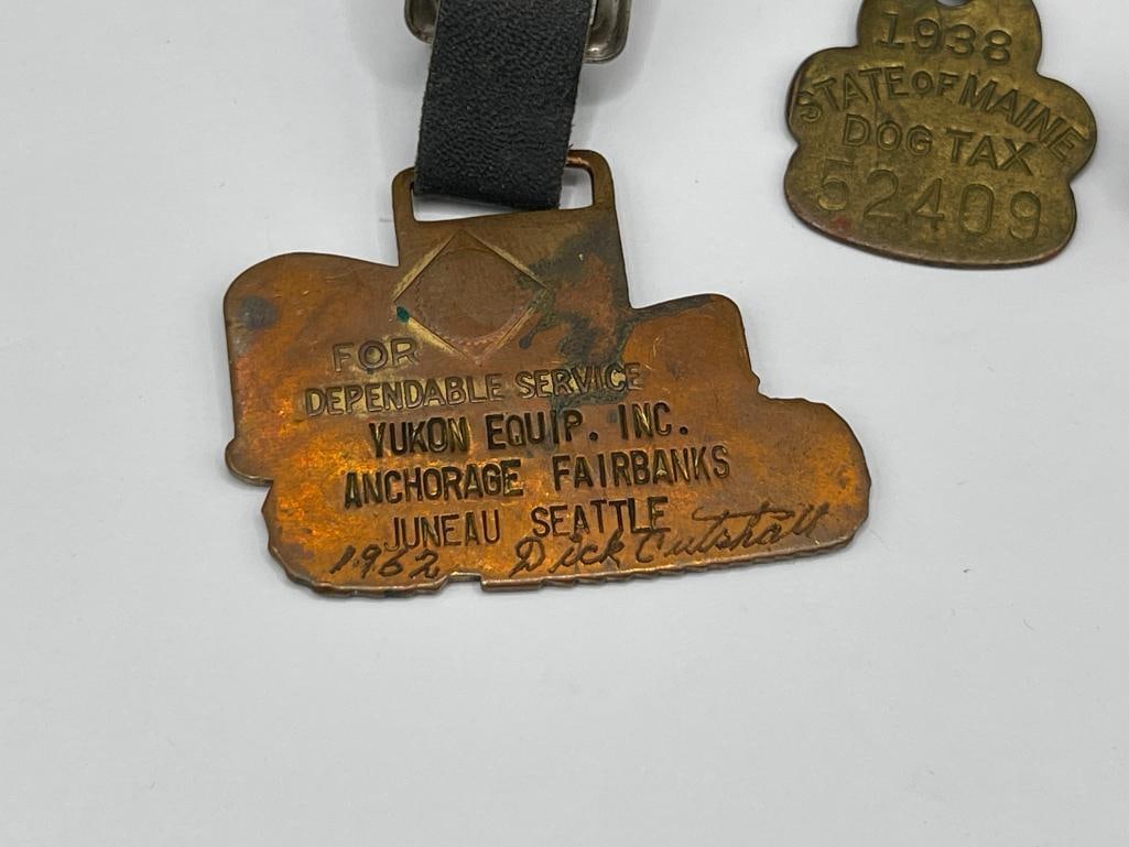 1938 DOGTAX STATE OF MAINE BADGE AND 1962 YUKON EQUIP. ANCHORAGE TRACTOR WATCH FOB - 2