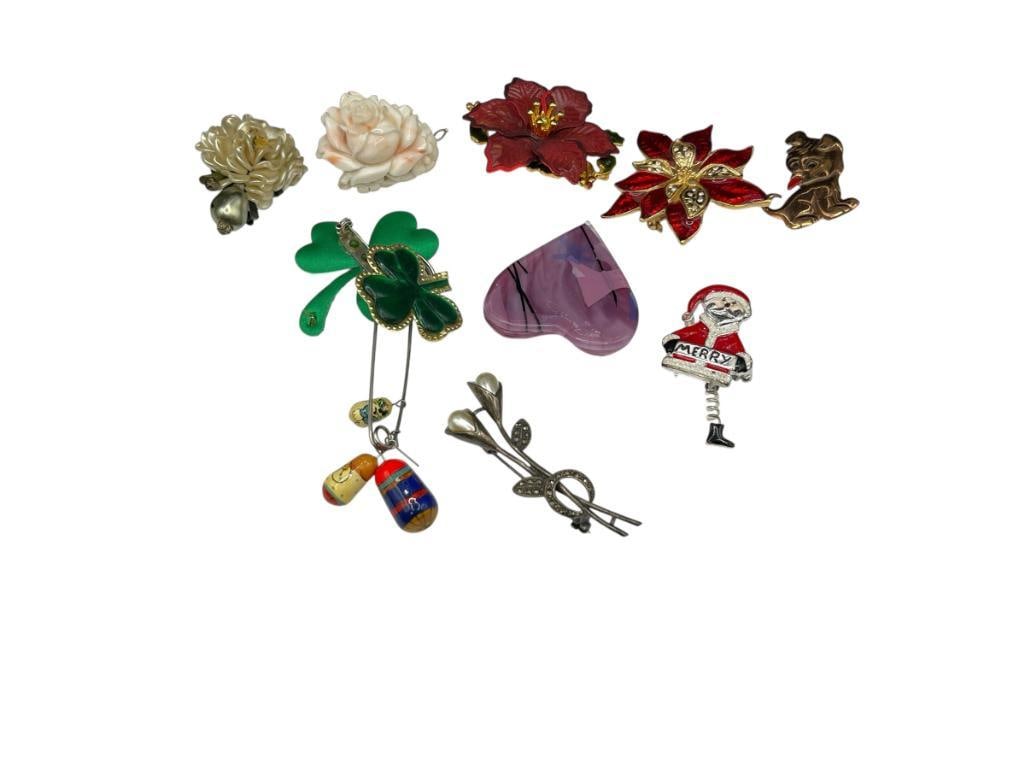 NNE ASSORTED FESTIVE BROOCHES INCLUDING ONE STERLING SILVER MARCASITE AND FAUX PEARL FLORAL BROOCH: INCLUDES HOLIDAY THEMES AND MORE 9.96 GRAM STERLING BROOCH 