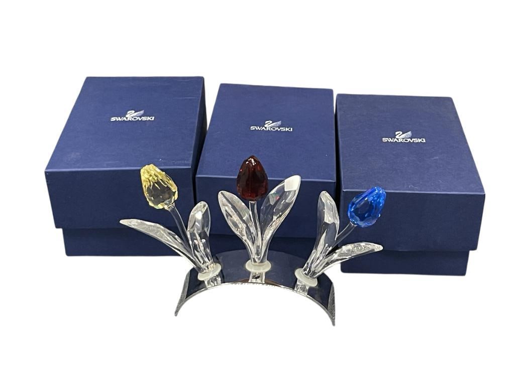 SWAROVSKI CRYSTAL SOCIETY MEMBERS RENEWAL CRYSTAL TULIPS, RED, YELLOW, AND GREEN: GIFT SET WAS PART OF A SCS RENEWAL GIFT FOR 2002 AND RETIRED IN 2004, EACH TULIP INCLUDES ITS ORIGINAL BOX, INCLUDES CHROME FINISH METAL DISPLAY OVERALL DIMENSIONS 4 1/4" H, 6" L 