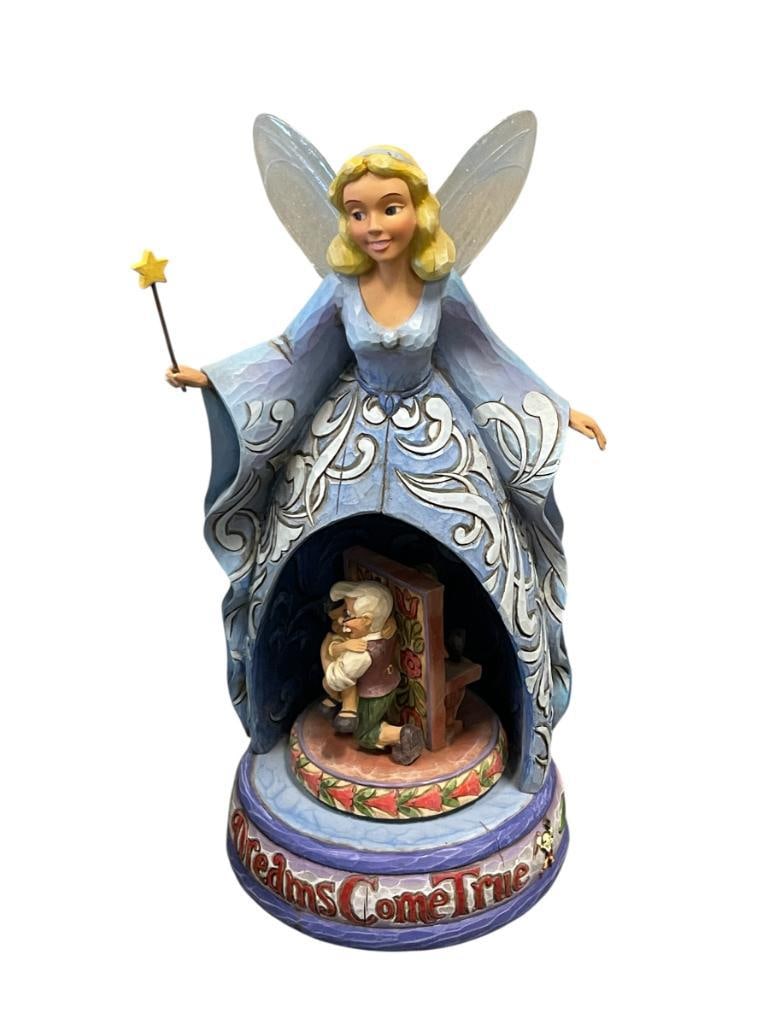 WALT DISNEY SHOWCASE MUSICAL ANIMATED FIGURINE OF PINOCCHIO TITLED DREAMS COME TRUE BY ENESCO: GEPETTO AND PINOCCHIO WITH BLUE FAIRY, FAIRY HAS DAMAGED FINGER ON RIGHT HAND 10 1/2" H 