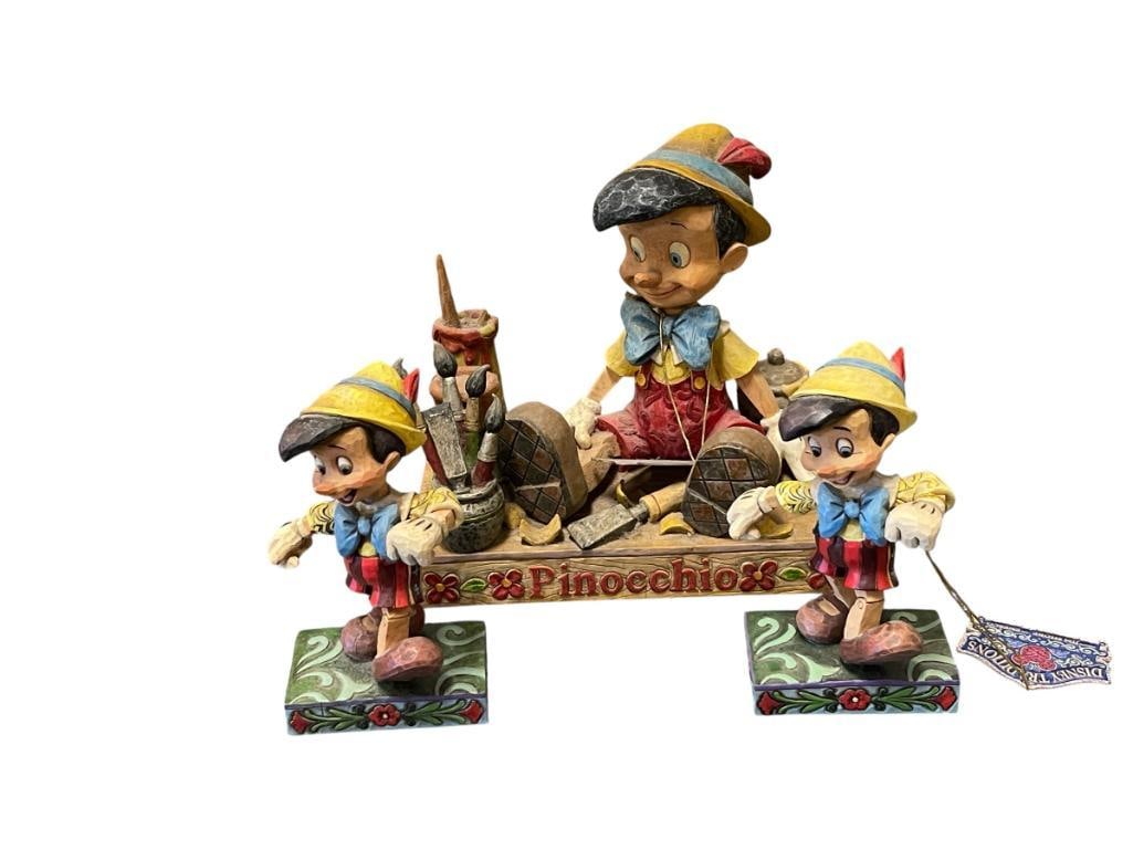 WALT DISNEY CLASSICS COLLECTION PINOCCHIO FIGURES BY ENESCO: DUPLICATE FIGURES LIVELY STEP, ONE HAS HAD AN ARM REPAIRED PLUS LARGER FIGURINE CARVED FROM THE HEART, ALSO HAS DAMAGE 4 1/2" AND 6" H 