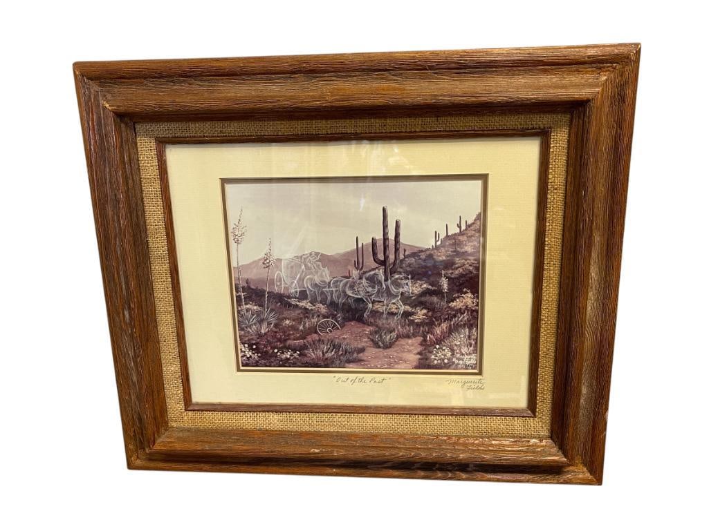 MARGUERITE FIELDS NATIVE AMERICAN AND NATURE ARTIST LIMITED EDITION PRINT TITLED OUT OF THE PAST: MARGUERITE FIELDS (1942-2013) BORN IN PALO ALTO, CA., ART DEPICTS GHOST HORSE DRAWN STAGECOACH WITH RIDERS RIDING THROUGH DESERT, NO. 75/500, SIGNED LOWER RIGHT, FRAMED 19 1/2" X 16 1/2" FRAME 