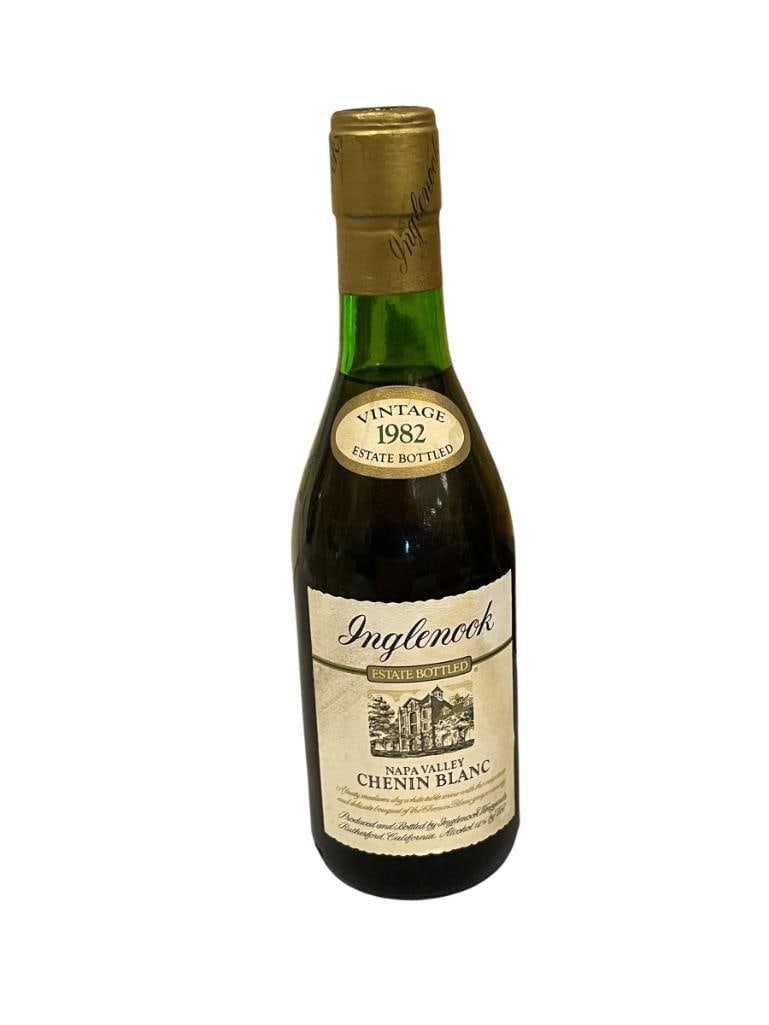 VINTAGE SEALED 1982 INGLENOOK NAPA VALLEY CHENIN BLANC 375ML BOTTLE: UNKNOWN HOW BOTTLE WAS STORED, SOME SEDIMENT AT THE BOTTOM, MUST BE 21+ IN ORDER TO BID AND PURCHASE ITEM, ID CHECK REQUIRED, NO SHIPPING PROVIDED 8 3/4" H