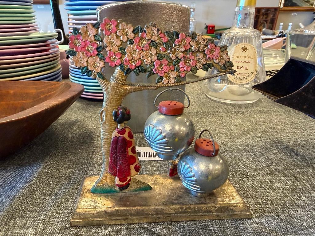 VINTAGE JAPANESE SILVER FINISH GEISHA AND CHERRY BLOSSOM SALT AND PEPPER SHAKER SET: LANTERN SALT AND PEPPER SHAKERS WITH GEISHA NEXT TO CHERRY BLOSSOM TREE HOLDER, HAND PAINTED ACCENTS, SHOWS WEAR, OVERALL IN GOOD CONDITION 6" H, 1 3/4" SHAKERS 
