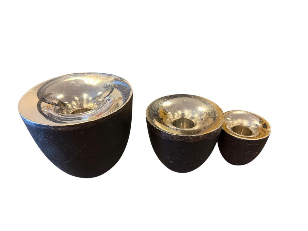 MID-CENTURY MODERN CAST IRON AND CHROME FINISH CANDLESTICK HOLDERS IN GRADUATING SIZES: EACH SHOW LIGHT WEAR TO FINISH 2", 3", AND 4" ROUND