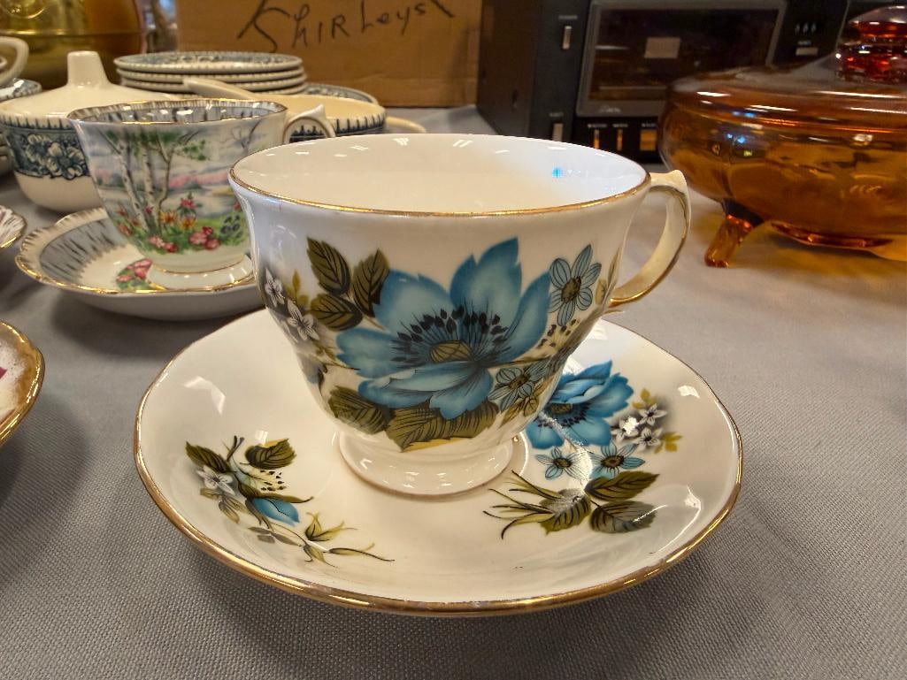 EIGHTS SETS OF VINTAGE CUPS AND SAUCERS: MOST ARE ENGLISH MADE INCLUDING ROYAL GRAFTON, ELIZABETH, QUEEN ANNE, AND MORE, FLORAL PATTERNS, NO CHIPS OR CRACKS LARGEST HAVE 5 1/2" SAUCERS AND 2 1/2" CUP 