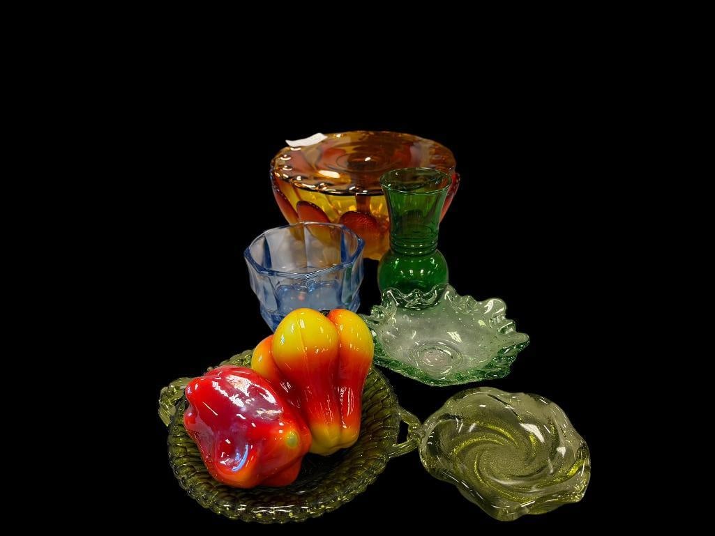 ASSORTED RETRO VINTAGE COLORED GLASS TABLEWARE INCLUDING PIE PLATTER, LEAF BOWL, AND ART GLASS: ALL FEATURE VIBRANT COLORS INCLUDING SEVERAL GREEN PIECES, FIGURAL VEGETABLES, ASHTRAYS, AND MORE, NO CHIPS OR CRACKS LARGEST IS 11" BOWL
