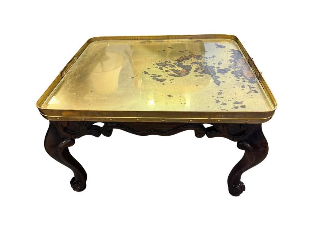 VINTAGE 1990'S CARVED WOOD BASE AND BRASS GALLERY TRAY SIDE TABLE WITH GLASS INSERT: TRAY HAS STAINS ON METAL, WOOD FRAME IS IN GOOD CONDITION 28" X 24" X 17" 