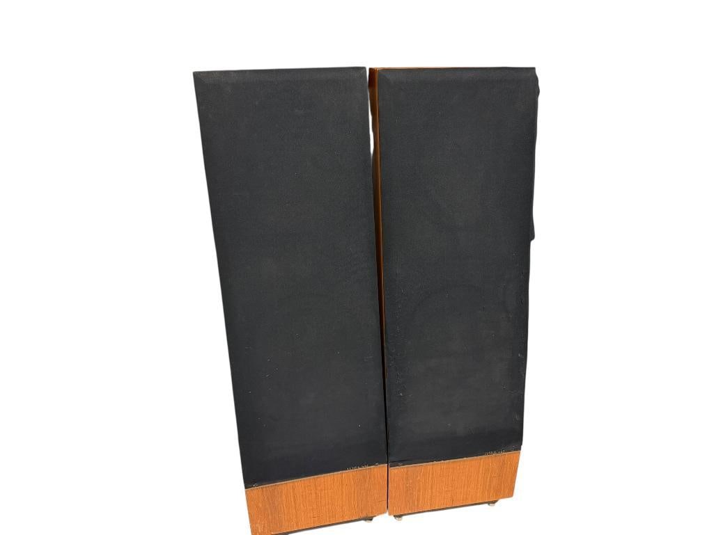PAIR OF VINTAGE CIRCA 1985 THIEL CS2 SLOPED FRONT FLOOR SPEAKERS: CABINETS ARE IN GOOD CONDITION WITH MINOR SCUFFS IN WOOD, ONE COVER IS GOOD BUT OTHER SHOWS WEAR, SPEAKERS APPEAR TO BE IN GOOD SHAPE 12" X 12" X 39 1/2"