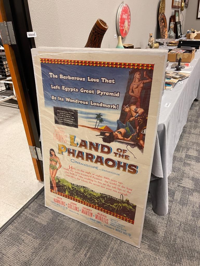 FOUR VINTAGE MOVIE POSTERS INCLUDING LAND OF THE PHAROAH'S, THE ANGRY HILLS, ICE PALACE, AND MORE: ALSO INCLUDES COUNT YOUR BLESSINGS, FEATURING VARIOUS STARS OF THE TIMES, ALL IN PRETTY GOOD CONDITION WITH MINOR TEARS AROUND EDGES, FILMS BY MGM AND WARNER BROTHERS 28" X 42"