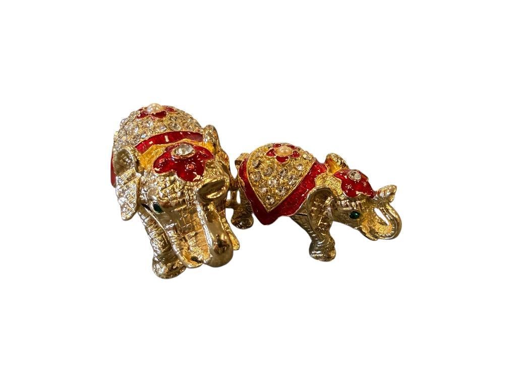 FANCY BEJEWELED AND ENAMELED ELEPHANT PILL / TRINKET BOXES WITH HINGED TOP: GOLD FINISH WITH RED ENAMELING AND CLEAR AND GREEN STONES 2" AND 2 7/8" 