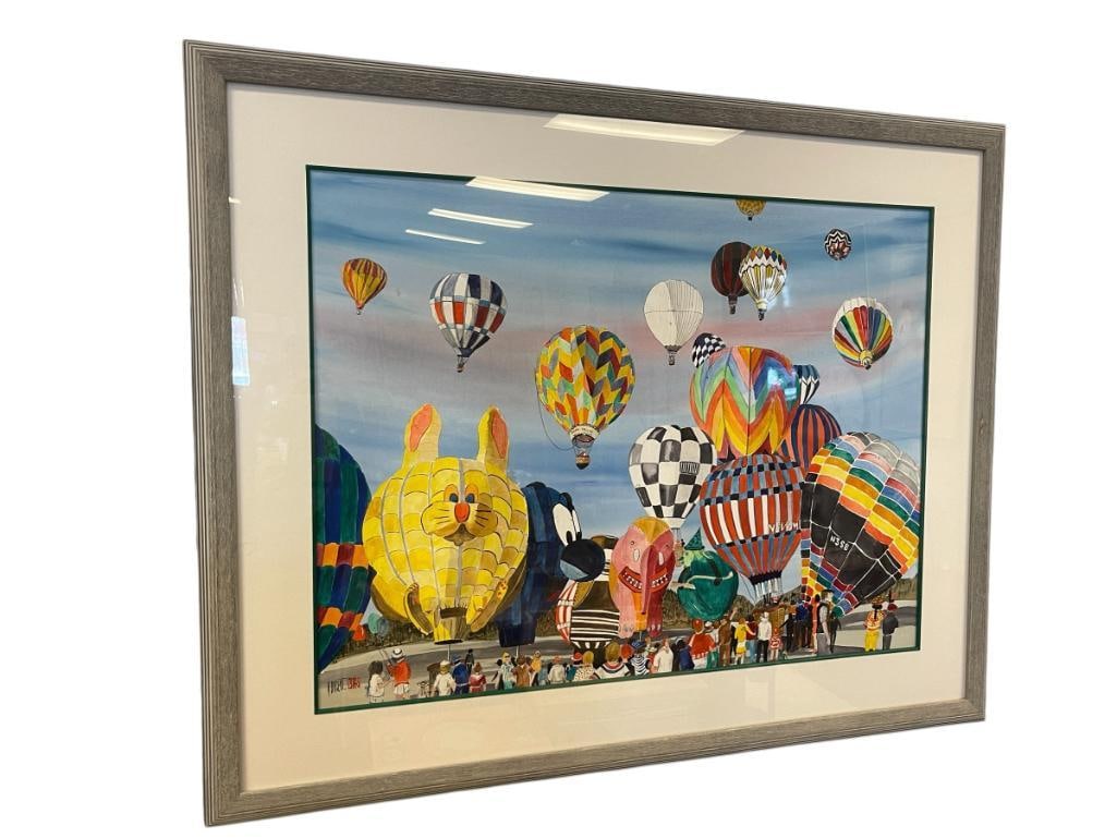 AUDREY DYGERT TRUCKEE, CA. ARTIST ORIGINAL WATERCOLOR ON PAPER HOT AIR BALLOON FEST, LARGE: AUDREY DYGERT (1922-2010) CALIFORNIA ARTIST, ART DEPICTS A SCENE OF HOT AIR BALLOONS TAKING OFF FROM A FIELD WITH MANY PEOPLE WATCHING, HILLS IN THE BACKGROUND, SIGNED LOWER LEFT, FRAMED 51" X