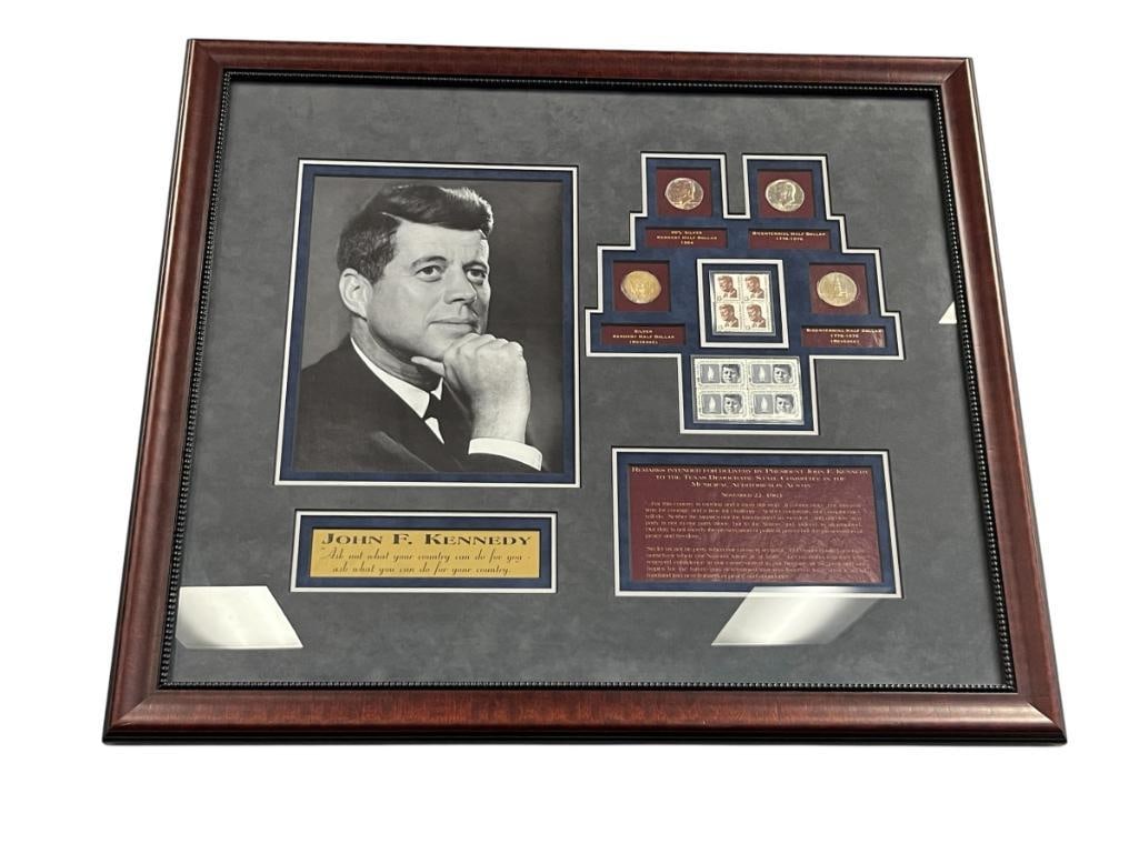 JOHN F. KENNEDY FORMER UNITED STATES PRESIDENT ENSEMBLE WITH PORTRAIT, COINS, AND STAMPS: JOHN F. KENNEDY ENSEMBLE INCLUDING FAMOUS QUOTE, BLACK AND WHITE PORTRAIT PRINT, TWO 1964 HALF DOLLARS, TWO BICENTENNIAL HALF DOLLARS, FOUR 5 CENT AND FOUR 13 CENT STAMPS, FRAMED 25 1/2" X 22 1/2"